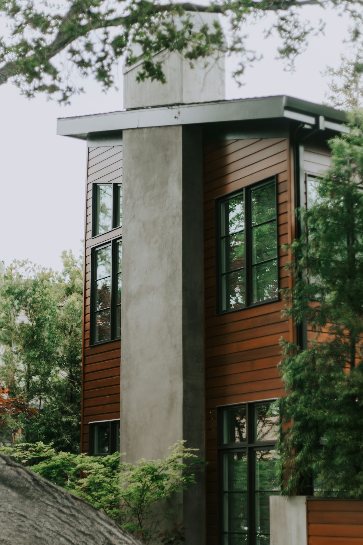 Modern house with wooden siding and large windows