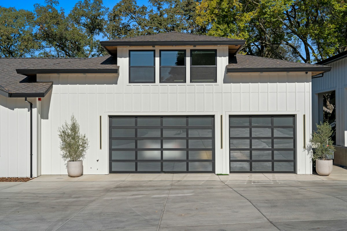 Modern garage doors on a white house