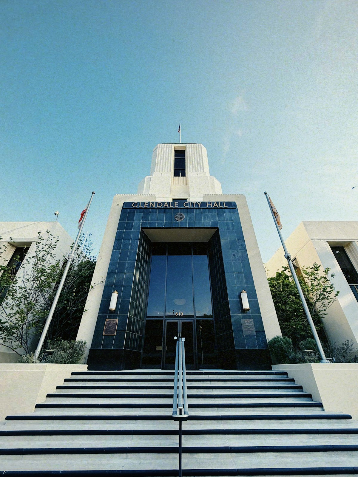 Glendale city hall building with wide stairs and flags